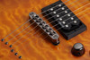 Schecter Omen Extreme-6 String Electric Guitar with quilted maple top, dual humbuckers, and contoured body design in gloss finish.