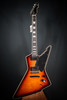 Schecter E-1 Custom Electric Guitar in Vintage Sunburst finish with Explorer-style body, dual humbuckers, and chrome hardware.