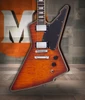Schecter E-1 Custom Electric Guitar in Vintage Sunburst finish with Explorer-style body, dual humbuckers, and chrome hardware.