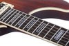 Schecter C-1 E/A Electric Guitar in Ca-s Eye finish with semi-hollow body design, dual pickups, and chrome hardware.