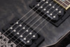 Schecter Omen Extreme FR Electric Guitar - See-Thru Black finish with quilted maple top, Floyd Rose tremolo, and dual humbuckers delivering aggressive tone and smooth playability