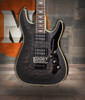 Schecter Omen Extreme FR Electric Guitar - See-Thru Black finish with quilted maple top, Floyd Rose tremolo, and dual humbuckers delivering aggressive tone and smooth playability