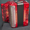 The Hohner Corona II XTREME FBbEb diatonic accordion in pearl red (CXFR) delivers powerful projection and fast response, ideal for norteÃƒÂ±o and conjunto styles. Available at Musician Madness.