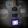 Cort/Manson Custom MBM-1 Matthew Bellamy Signature Guitar – Silver Satin finish with integrated XY pad, Sustainiac pickup system, and custom design inspired by Muse’s Matthew Bellamy