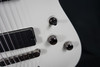 Schecter Demon-7 Electric Guitar - Vintage White (B-Stock) 7-string guitar with Schecter Diamond Active pickups, arched top body, black hardware, and smooth extended-range tone