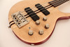 Cort A4PLUSFMMHOPN Artisan Series A4 Plus Bass Guitar in Open Pore Natural finish with flamed maple top and Bartolini MK-1 pickups.
