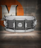 PDP Concept Series 5.5x14 Snare Drum in Black Nickel Over Steel finish with chrome hardware, producing bright tone, sharp attack, and modern visual appeal.