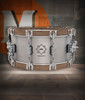 PDP Concept Select 6.5x14 Snare Drum with 3mm aluminum shell and walnut wood hoops, delivering clear tone, dynamic response, and stunning craftsmanship.