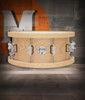 PDP Concept 20-Ply 6.5x14 Snare Drum in Natural Maple finish with thick wood hoops and maple shell, delivering warm tone, crisp attack, and exceptional projection.