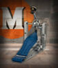 DW MFG Series Machined Chain Drive Single Pedal Cobalt Edition with included carry bag, featuring precision-machined cobalt blue components, chain-drive system, and adjustable beater assembly.