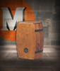 Latin Percussion M1406WB Whiskey Barrel Cajon featuring a large New Zealand pine body shaped like a whiskey barrel, delivering deep bass, crisp snare definition, and standout aesthetics ideal for acoustic and world percussion setups.