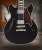 Dâ€™Angelico Premier Mini DC - Black Flake (DAPMDCBLF2NS) featuring a compact semi-hollow double-cut design, stop-bar tailpiece, dual humbuckers, and a rich Dark Iced Tea Burst finish for warm, versatile tone.