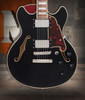DÃ¢â‚¬â„¢Angelico Premier Mini DC - Black (DAPMDCSBKNS) featuring a compact semi-hollow double-cut design, stop-bar tailpiece, dual humbuckers, and a rich versatile tone.