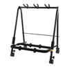 Hercules GS523BPLUS 3-Piece Guitar Rack Stand with Casters featuring padded supports, a sturdy foldable frame, and rolling casters for easy transport of up to three acoustic, electric, or bass guitars.