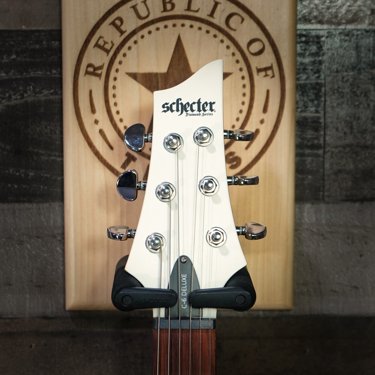Schecter C-6 Deluxe Satin White Electric Guitar with dual humbuckers, basswood body, and smooth satin white finish.