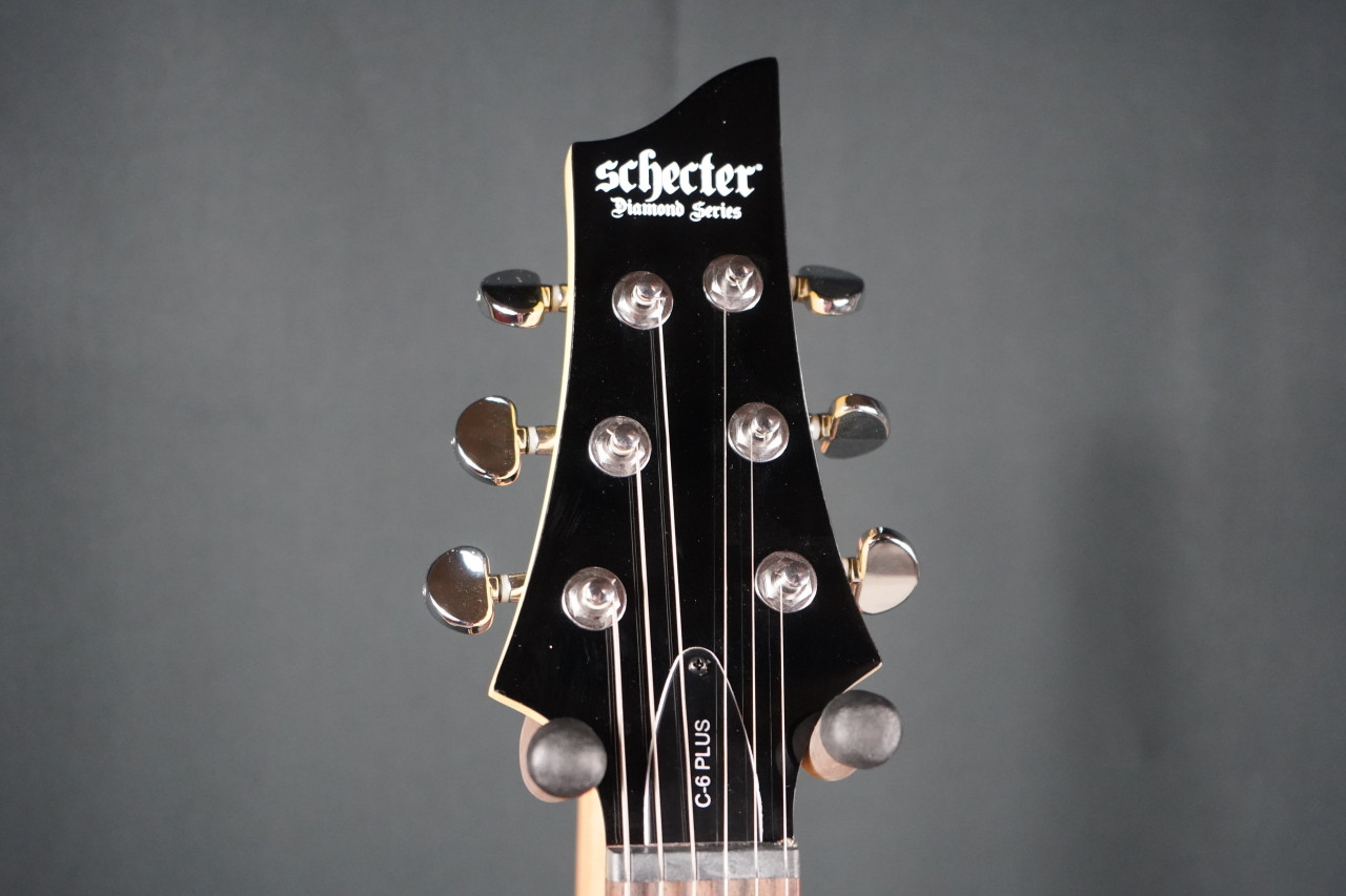 Schecter C-6 Plus See Thru Cherry Burst Electric Guitar (B-Stock) with quilted maple top, dual humbuckers, and glossy cherry burst finish.