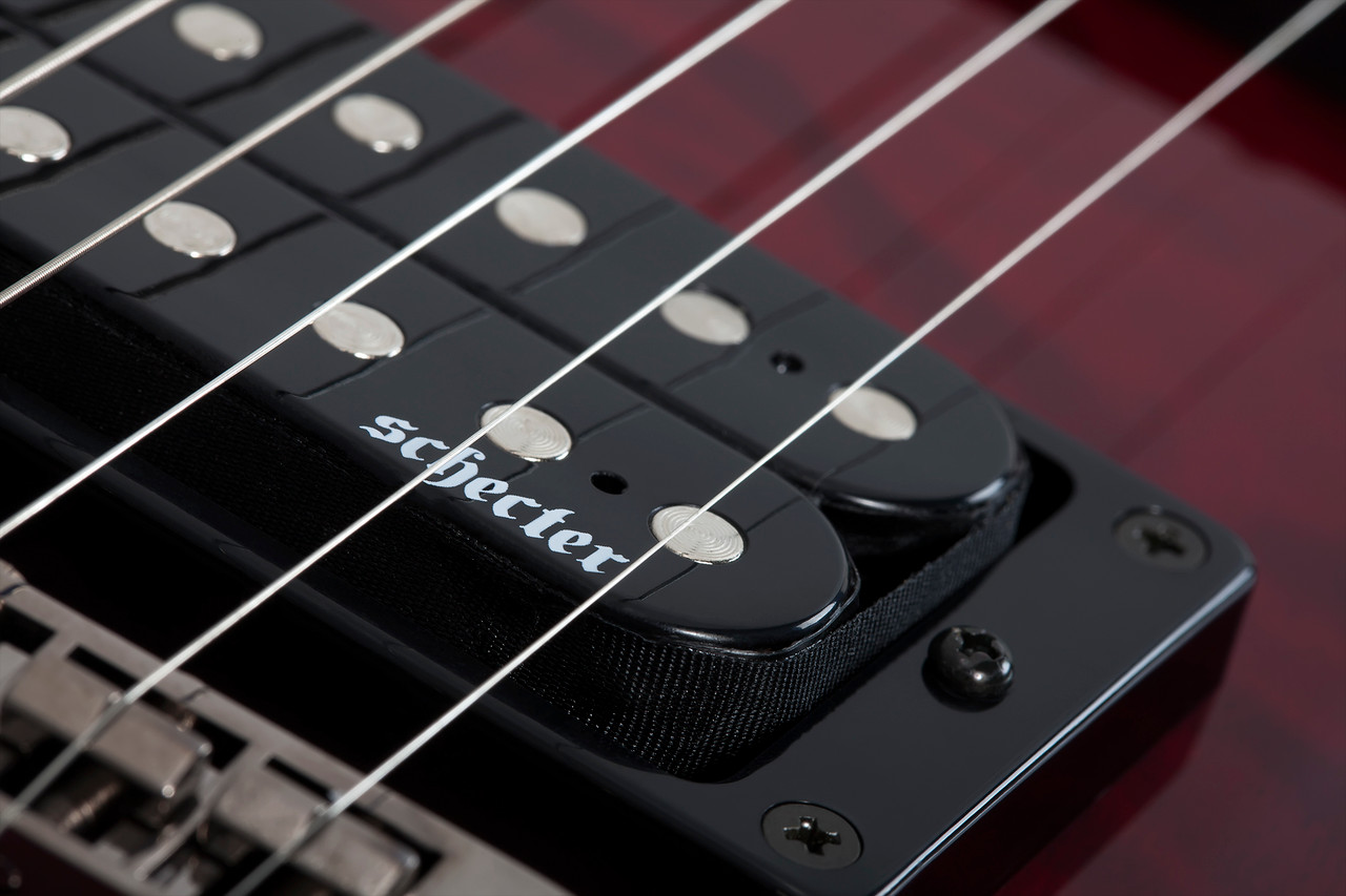 The Schecter Omen Extreme-7 String Electric Guitar (Item #2008) features a stunning Black Cherry quilted maple top over a mahogany body, delivering rich resonance and aggressive bite. Its thin-C maple neck and rosewood fingerboard provide fast, comfortable playability, while Schecter Diamond Plus humbuckers deliver high-output tone suited for metal, rock, and modern extended-range styles. Additional features include black chrome hardware, Tune-O-Matic bridge, and sleek multi-ply binding.