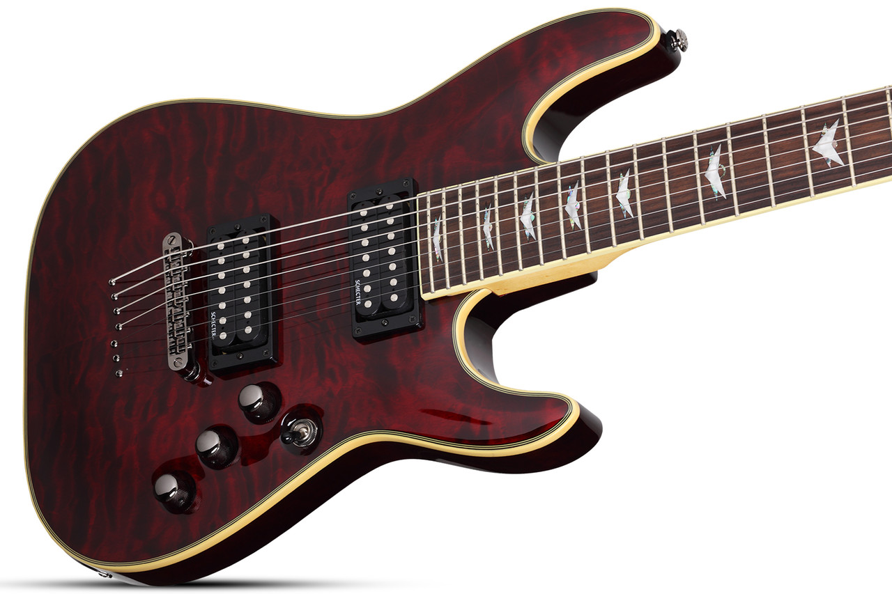 The Schecter Omen Extreme-7 String Electric Guitar (Item #2008) features a stunning Black Cherry quilted maple top over a mahogany body, delivering rich resonance and aggressive bite. Its thin-C maple neck and rosewood fingerboard provide fast, comfortable playability, while Schecter Diamond Plus humbuckers deliver high-output tone suited for metal, rock, and modern extended-range styles. Additional features include black chrome hardware, Tune-O-Matic bridge, and sleek multi-ply binding.