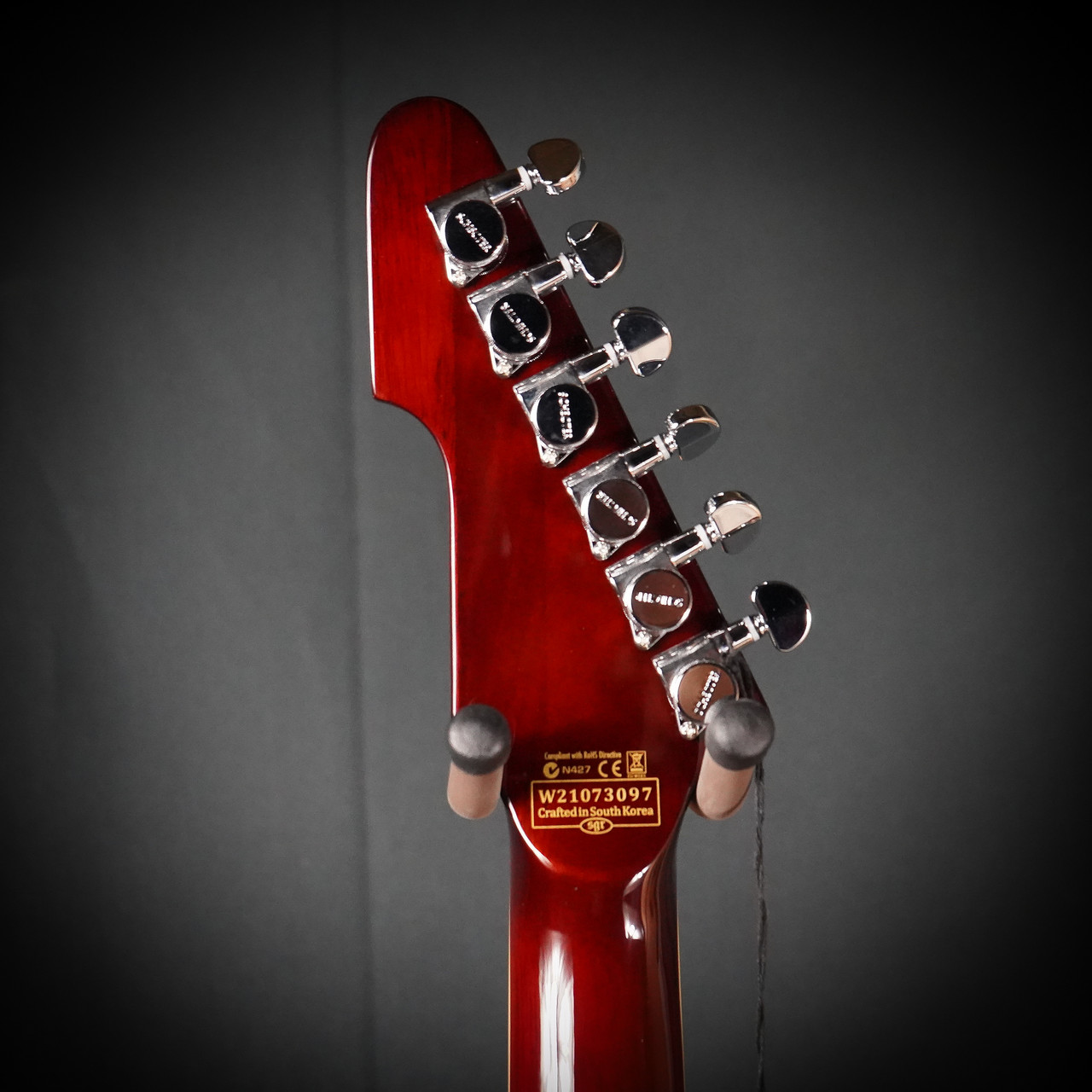 Schecter E-1 Custom Electric Guitar in Vintage Sunburst finish with Explorer-style body, dual humbuckers, and chrome hardware.