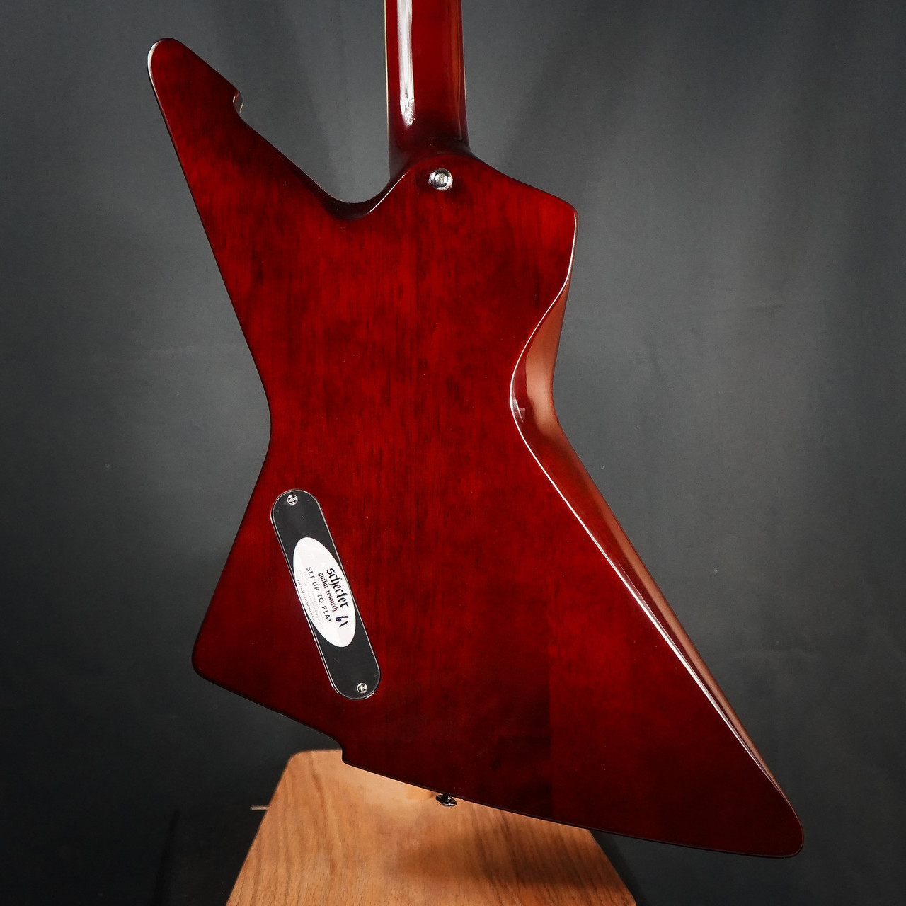 Schecter E-1 Custom Electric Guitar in Vintage Sunburst finish with Explorer-style body, dual humbuckers, and chrome hardware.