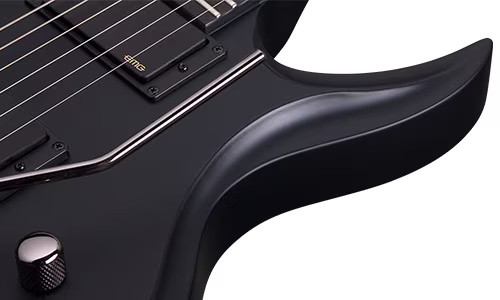 Schecter Tommy Victor Devil FR Electric Guitar with arched mahogany body, dual humbuckers, and Floyd Rose tremolo system in gloss black finish.