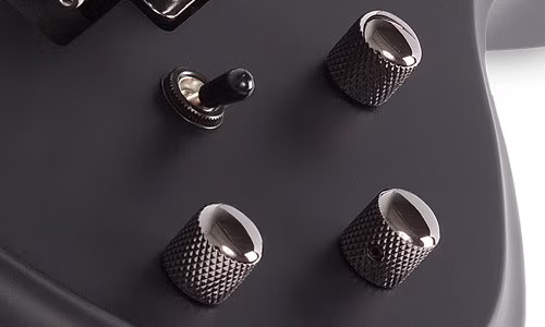 Schecter Tommy Victor Devil FR Electric Guitar with arched mahogany body, dual humbuckers, and Floyd Rose tremolo system in gloss black finish.