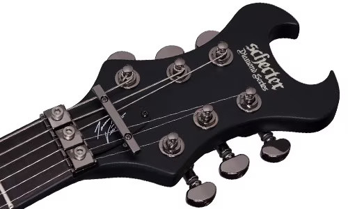 Schecter Tommy Victor Devil FR Electric Guitar with arched mahogany body, dual humbuckers, and Floyd Rose tremolo system in gloss black finish.