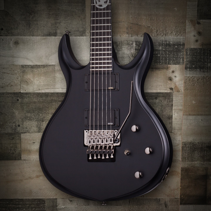 Schecter Tommy Victor Devil FR Electric Guitar with arched mahogany body, dual humbuckers, and Floyd Rose tremolo system in gloss black finish.