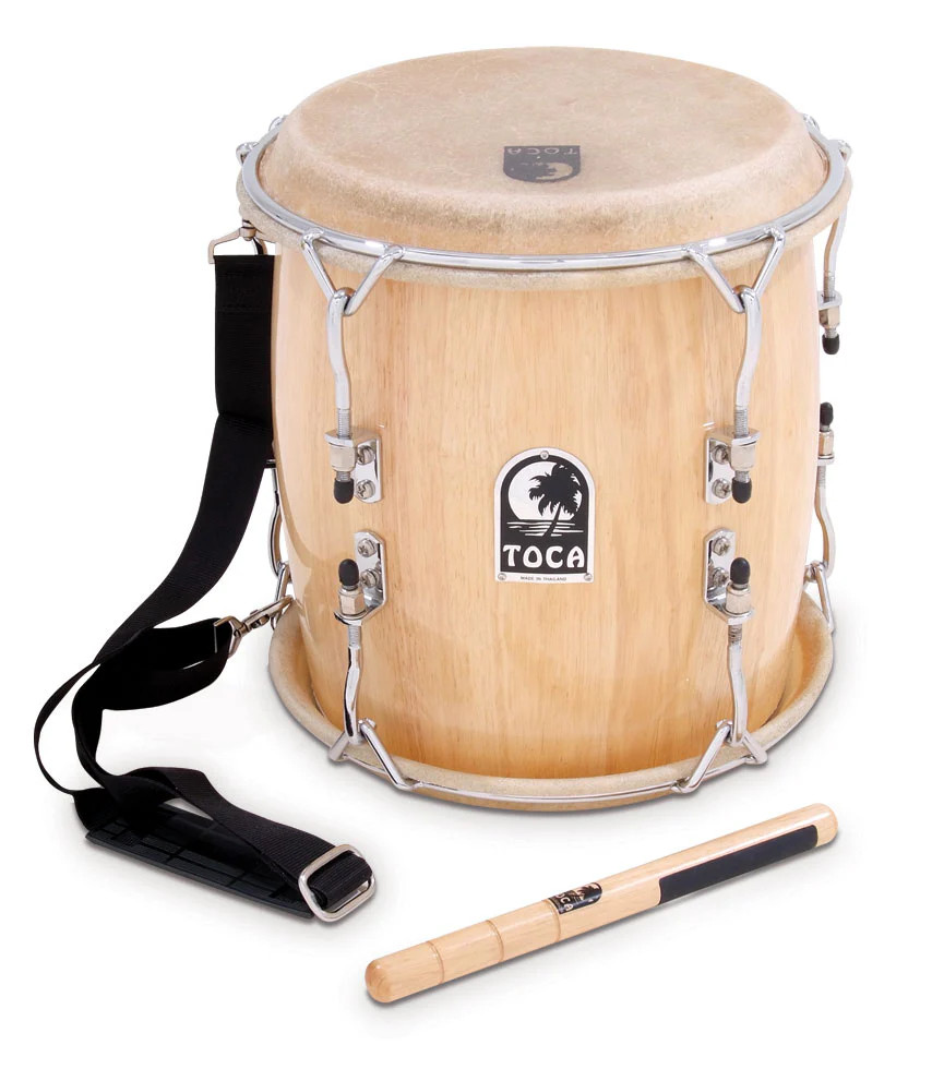 Toca Pro Tambora - Natural (TTAM-N) featuring natural wood shell construction, traditional Dominican tambora design, and durable hardware for authentic Latin percussion performance.