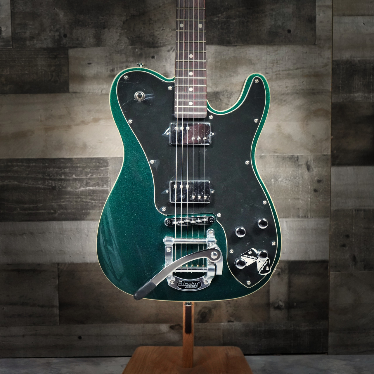 dark green electric guitar