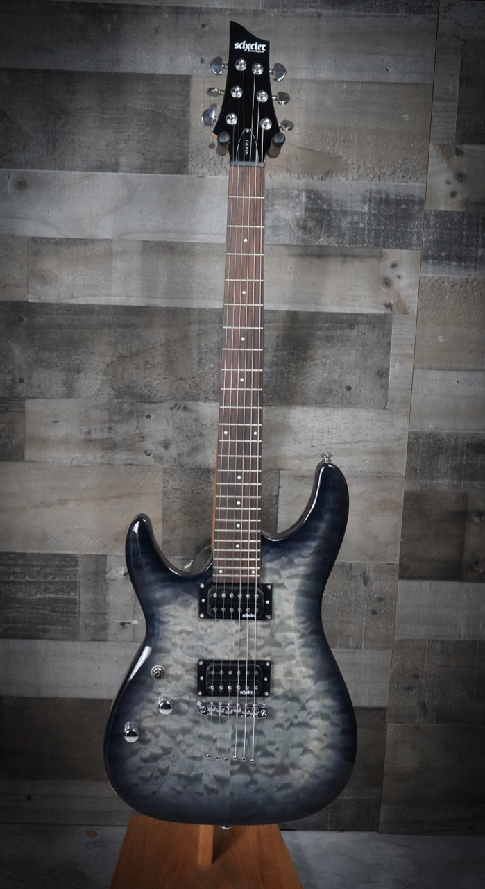The Schecter C-6 Plus Left-Handed Electric Guitar (448) features a visually striking quilted maple top, smooth thin-C neck, and powerful humbuckers for punchy, versatile tone. Designed for left-handed players, it offers excellent build quality, comfortable playability, and modern stylingâ€”an ideal choice for rock, metal, and everyday practice.