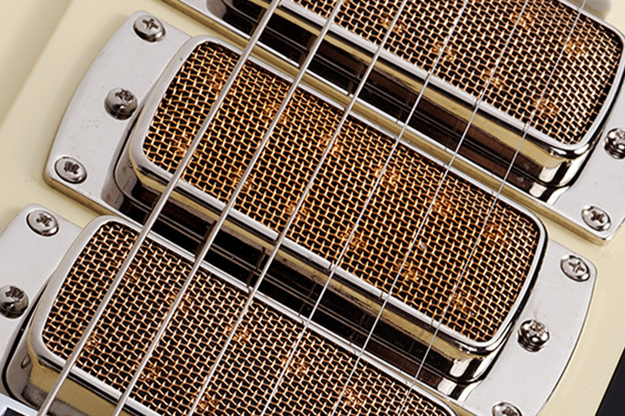 Schecter Ultra III Electric Guitar - Ivory Pearl finish featuring offset body design, dual humbuckers, chrome hardware, and smooth neck for vintage tone with modern performance