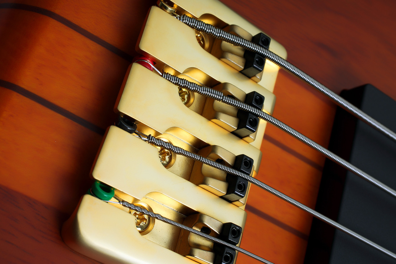 Schecter Stiletto Studio-4 HSN Electric Bass Guitar - Honey Satin finish featuring neck-thru construction, EMG pickups, active EQ, and smooth contoured body for professional tone and feel