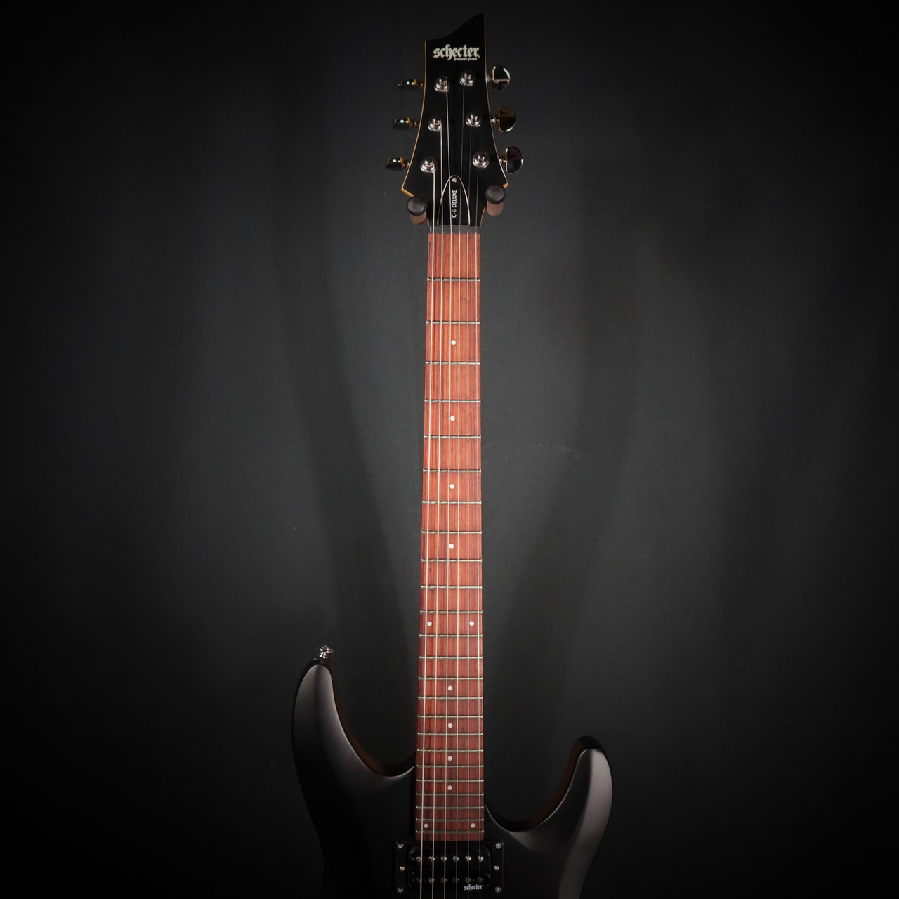 Schecter C-6 Deluxe Electric Guitar - Satin Black finish with dual humbuckers, lightweight basswood body, and smooth maple neck for modern tone and easy playability