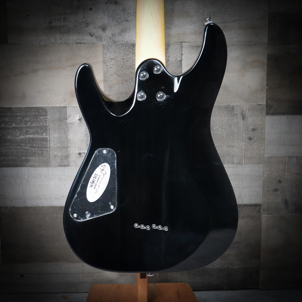 The Schecter C-6 Plus in Charcoal Burst (446) features an eye-catching quilted maple top paired with a lightweight body for comfortable playability. High-output humbuckers deliver punchy, versatile tone suitable for rock, metal, blues, and everyday practice. Complete with a smooth thin-C neck and Schecterâ€™s dependable hardware, i-s a great fit for both beginners and intermediate players.