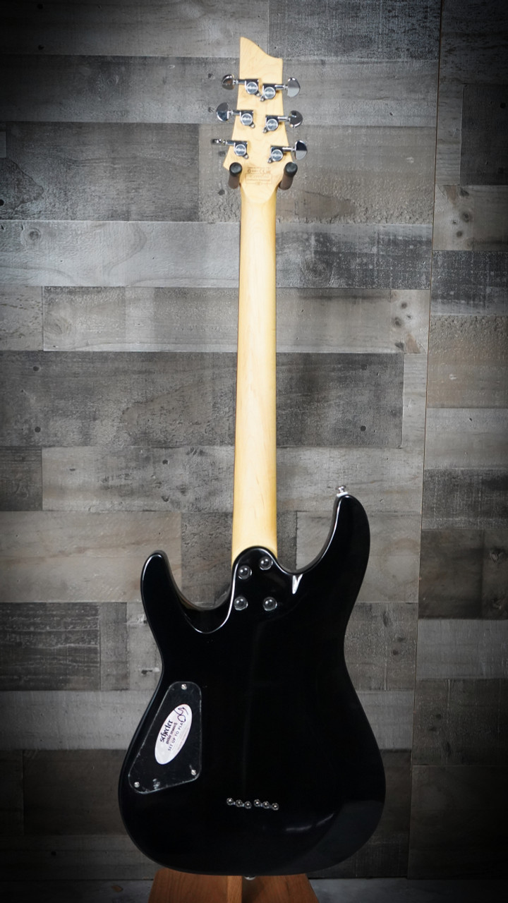 The Schecter C-6 Plus in Charcoal Burst (446) features an eye-catching quilted maple top paired with a lightweight body for comfortable playability. High-output humbuckers deliver punchy, versatile tone suitable for rock, metal, blues, and everyday practice. Complete with a smooth thin-C neck and Schecterâ€™s dependable hardware, i-s a great fit for both beginners and intermediate players.