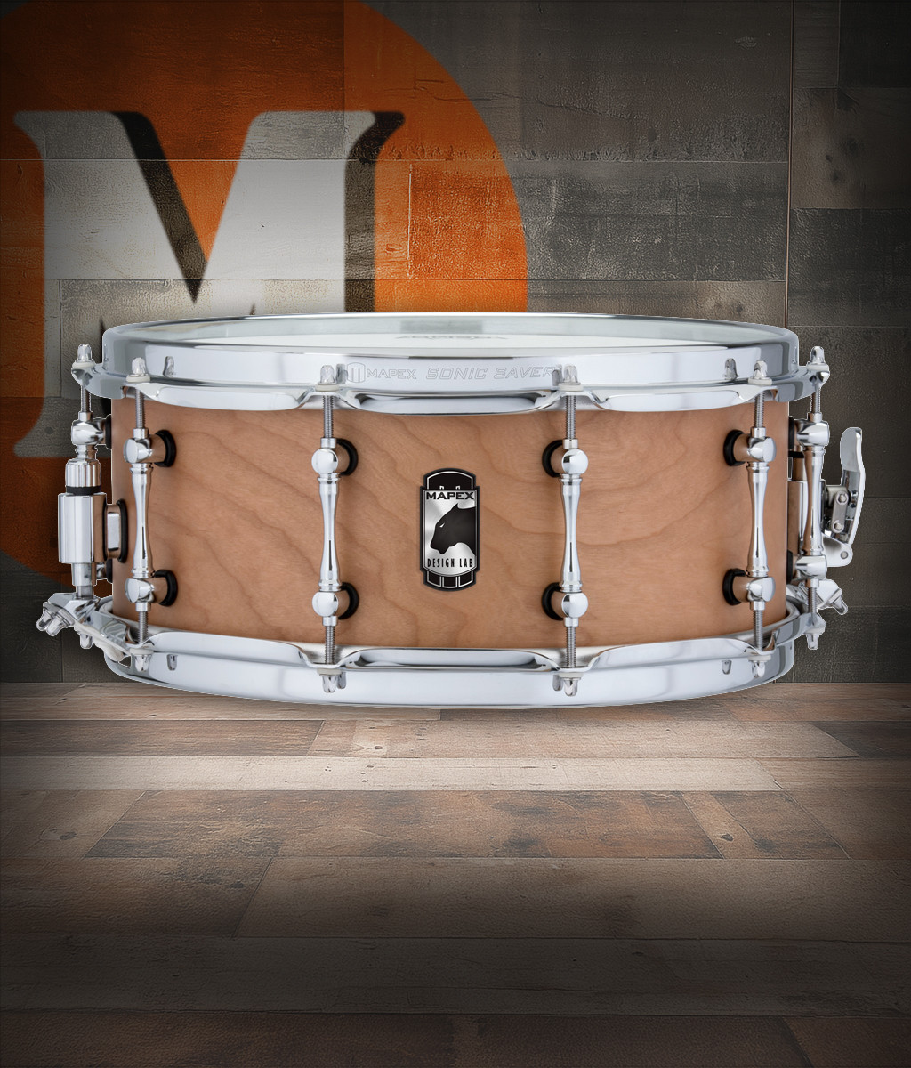 Mapex Black Panther Cherry Bomb Design Lab 13" x 5.5" Snare Drum (BPCW3550CNW) featuring a hybrid maple/poplar shell and precision hardware for warm, punchy, and articulate tone.