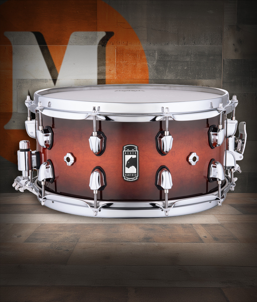 Mapex Black Panther Solidus 14" x 7" Snare Drum â€“ Red Black Burst (BPNML4700CVD) featuring a thick maple shell, deep tone, and high-volume projection for bold, dynamic performance.