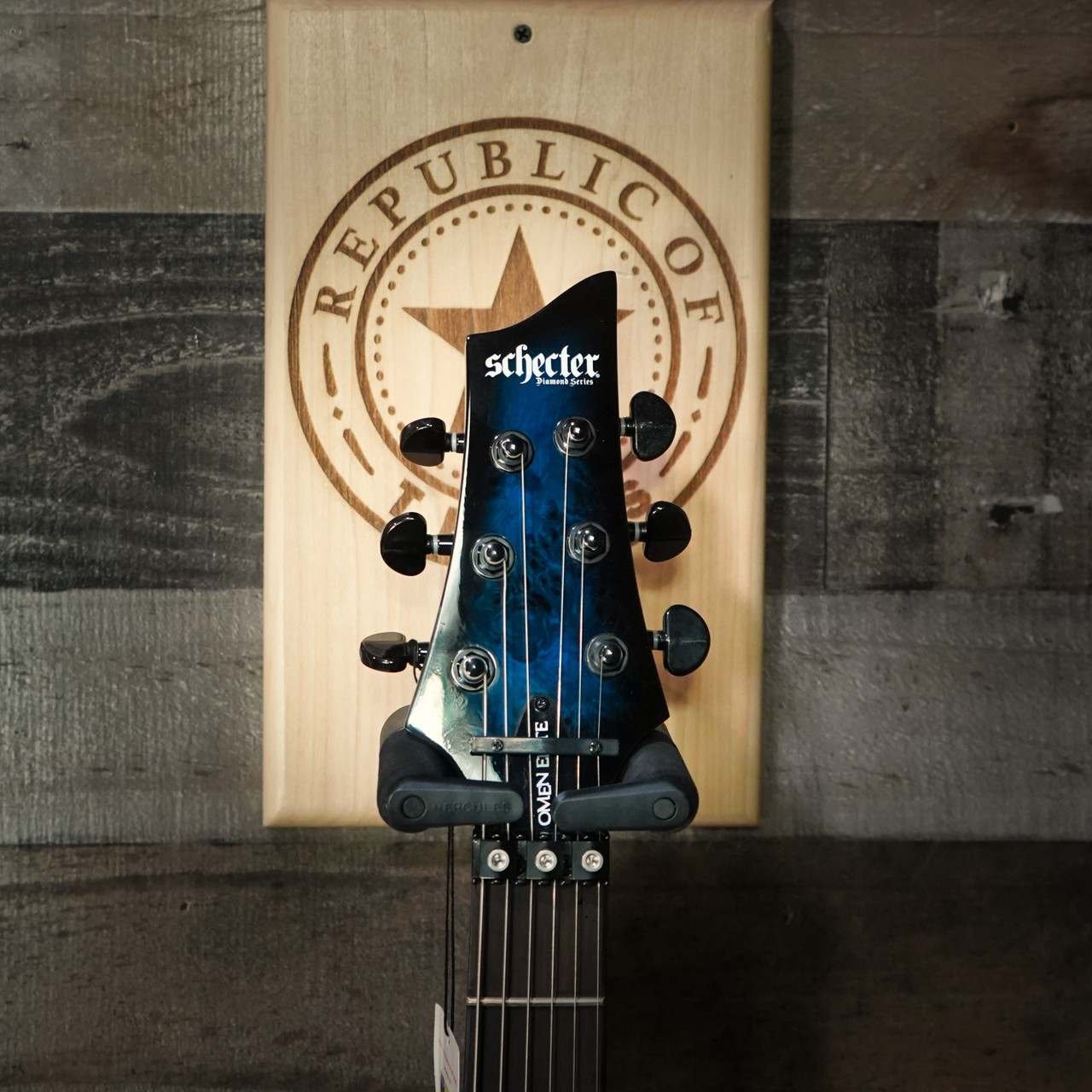 Schecter Omen Elite-6 FR Electric Guitar - Ocean Blue Burst featuring quilted maple top, Floyd Rose tremolo, Schecter Diamond pickups, and sleek black hardware for modern tone and style