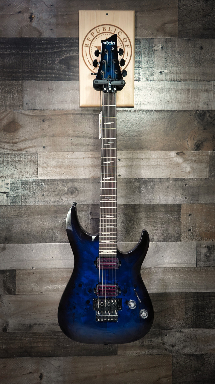 Schecter Omen Elite-6 FR Electric Guitar - Ocean Blue Burst featuring quilted maple top, Floyd Rose tremolo, Schecter Diamond pickups, and sleek black hardware for modern tone and style