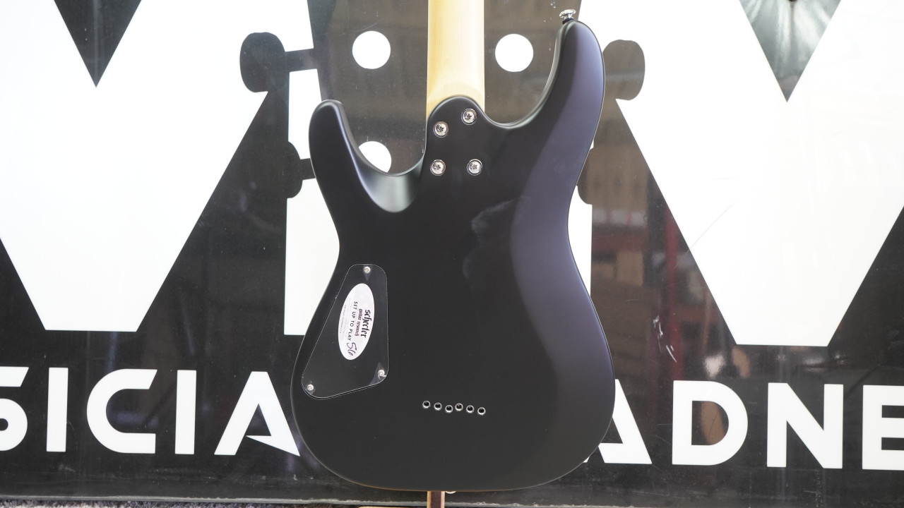 Schecter C-6 Deluxe Electric Guitar - Satin Black (B-Stock) featuring sleek satin finish, dual humbuckers, lightweight basswood body, and fast maple neck for versatile modern tone