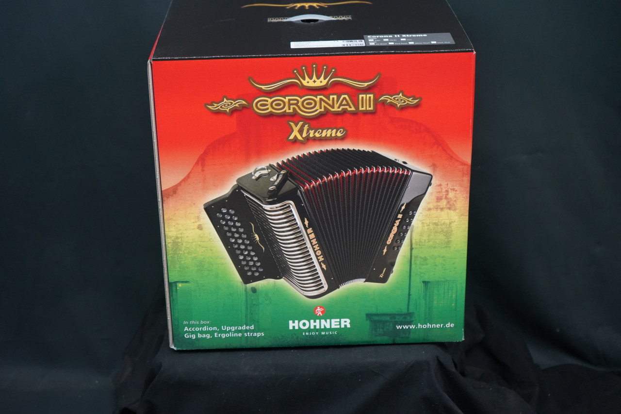 The Hohner Corona II XTREME FBbEb diatonic accordion in pearl red (CXFR) delivers powerful projection and fast response, ideal for norteÃƒÂ±o and conjunto styles. Available at Musician Madness.
