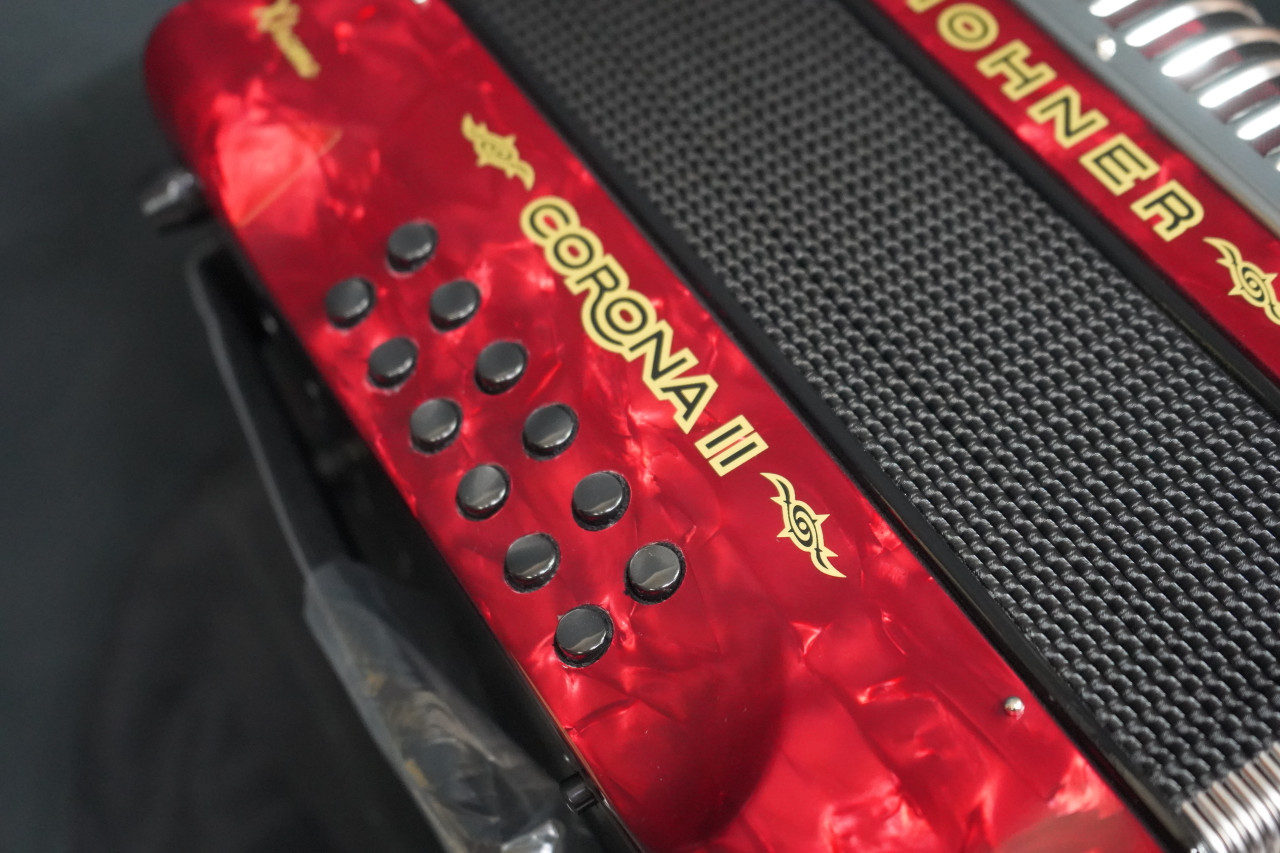 The Hohner Corona II XTREME FBbEb diatonic accordion in pearl red (CXFR) delivers powerful projection and fast response, ideal for norteÃƒÂ±o and conjunto styles. Available at Musician Madness.