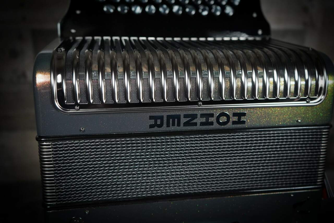 The Hohner Corona C-II Accordion delivers iconic tone and style. FBbEb key, Green-to-Gold finish, durable designÃ¢â‚¬â€perfect for NorteÃƒÂ±o, Tex-Mex & more.