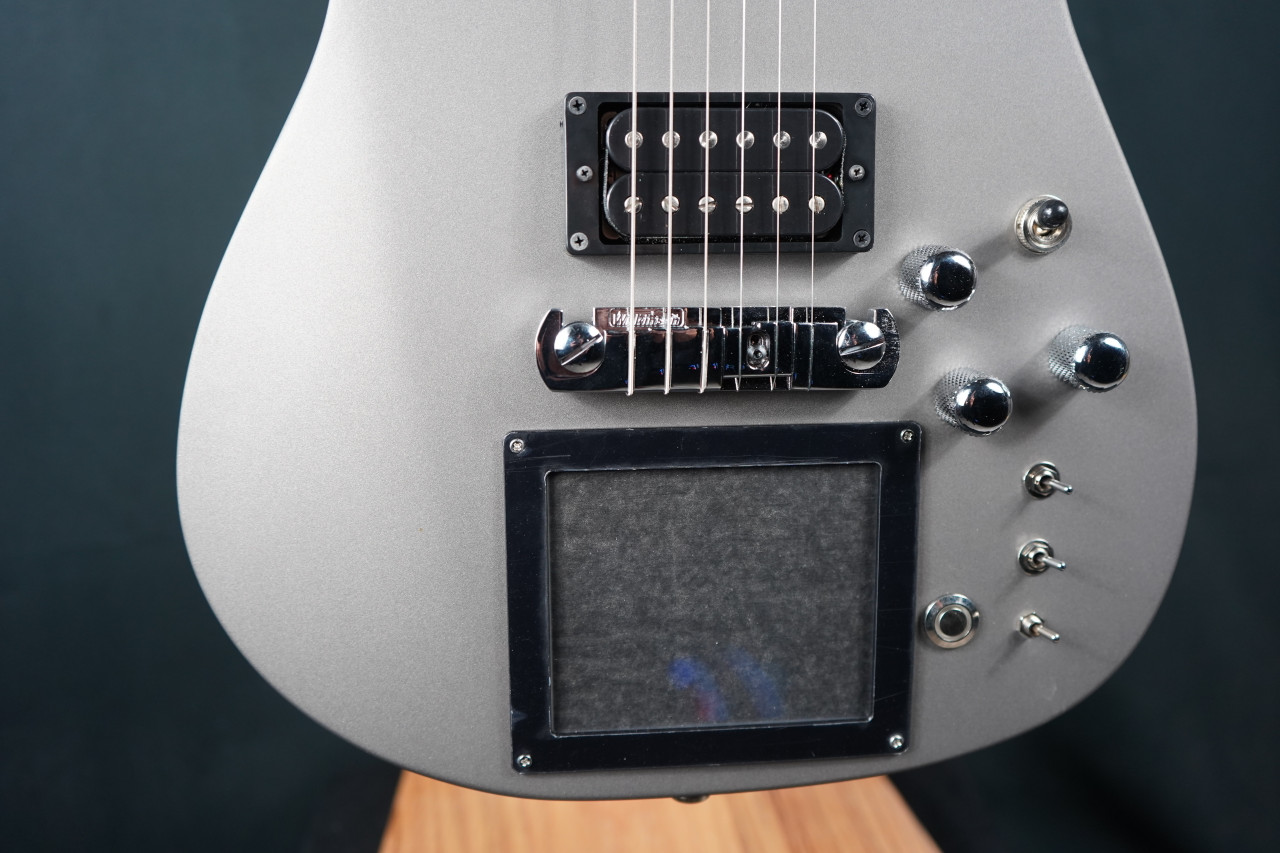 Cort/Manson Custom MBM-1 Matthew Bellamy Signature Guitar – Silver Satin finish with integrated XY pad, Sustainiac pickup system, and custom design inspired by Muse’s Matthew Bellamy