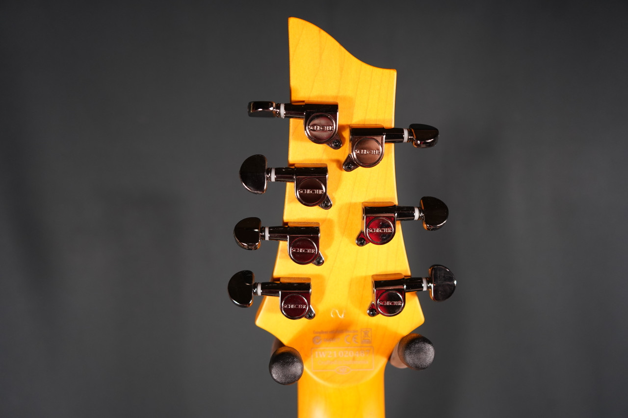 Schecter Demon-7 Electric Guitar - Vintage White (B-Stock) 7-string guitar with Schecter Diamond Active pickups, arched top body, black hardware, and smooth extended-range tone