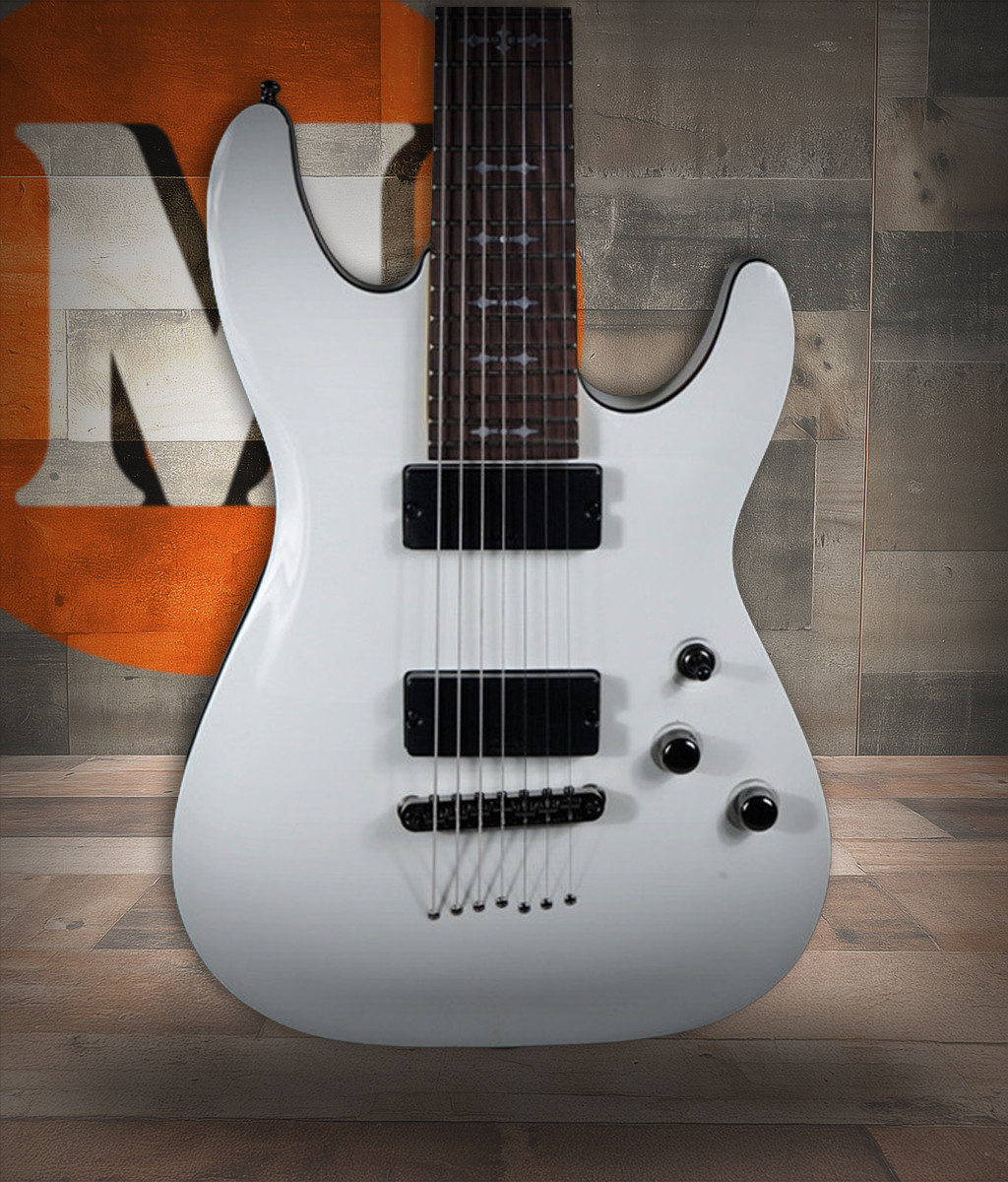 Schecter Demon-7 Electric Guitar - Vintage White (B-Stock) 7-string guitar with Schecter Diamond Active pickups, arched top body, black hardware, and smooth extended-range tone