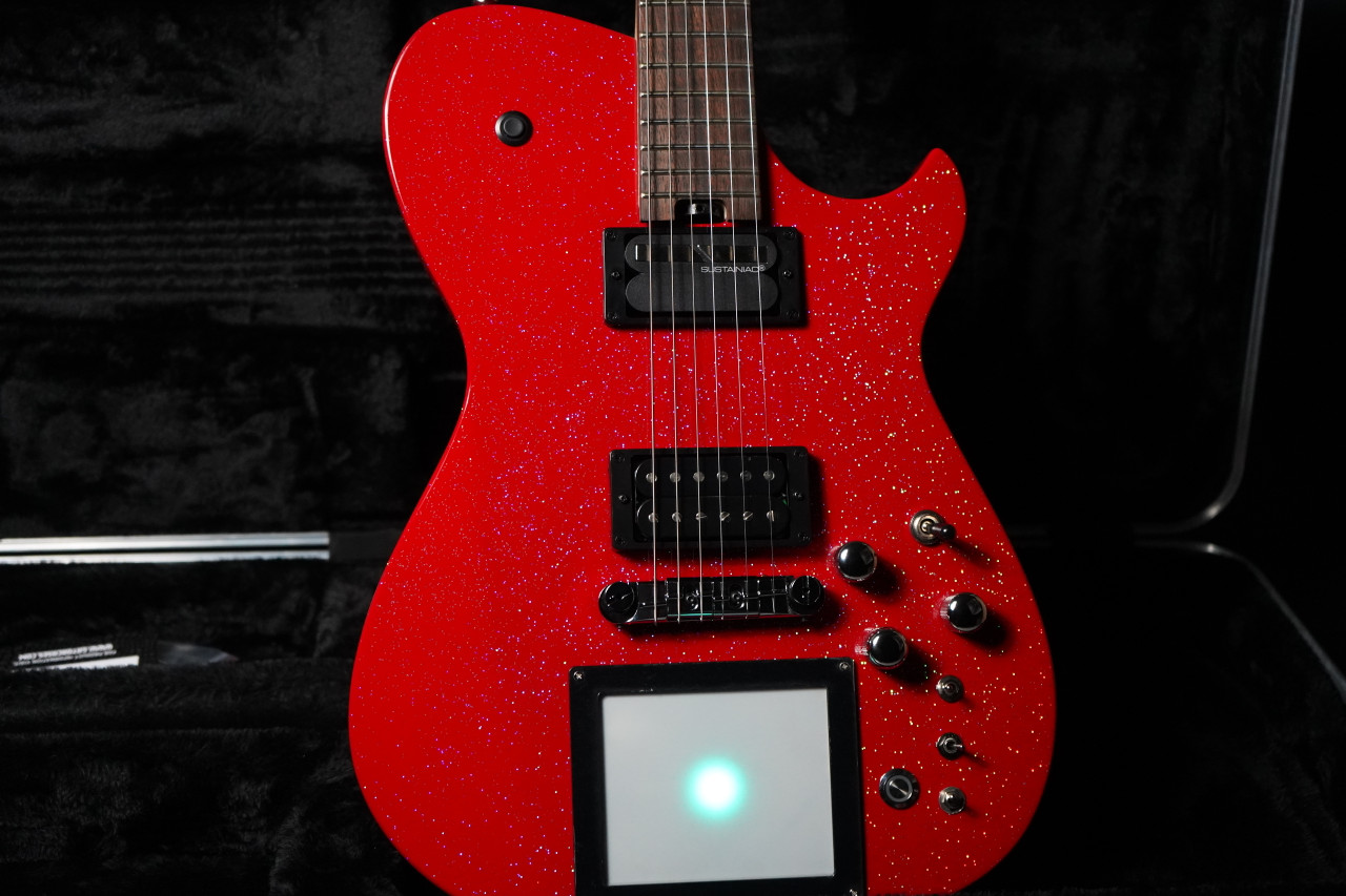 Cort Manson MBM-1 Electric Guitar in Red Santa finish â€“ signature model featuring integrated Kaoss Pad, Sustainiac pickup system, and ergonomic modern body design