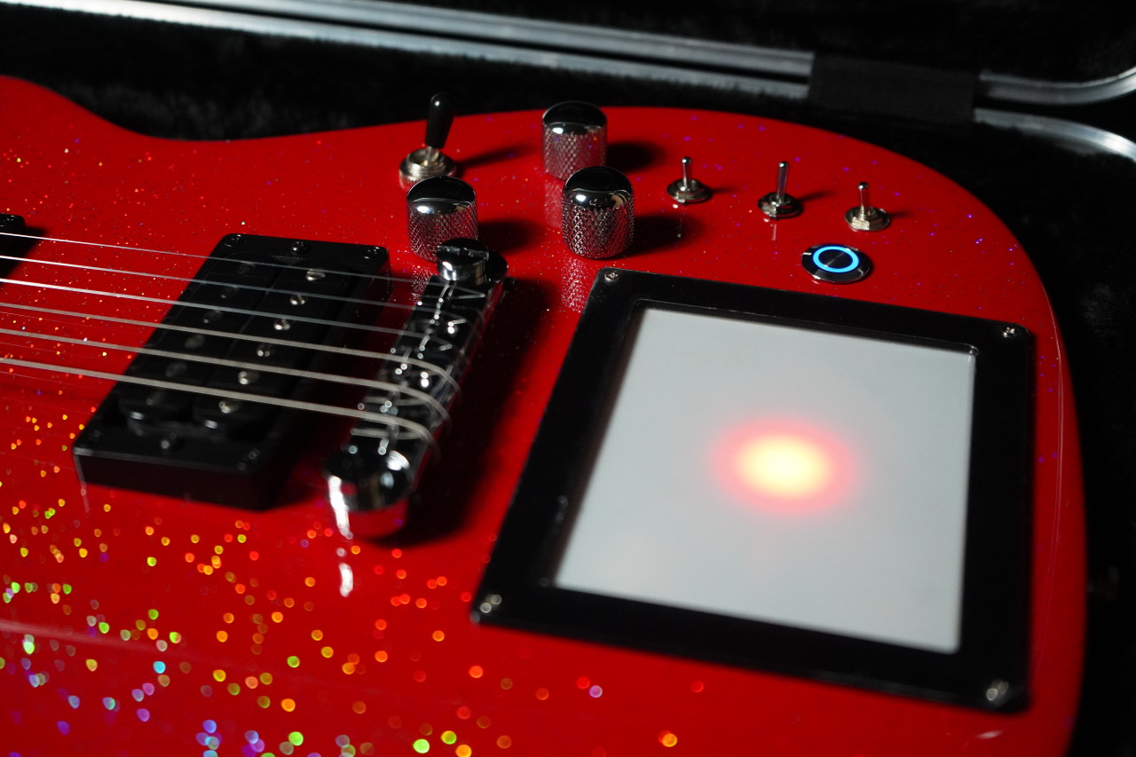 Cort Manson MBM-1 Electric Guitar in Red Santa finish â€“ signature model featuring integrated Kaoss Pad, Sustainiac pickup system, and ergonomic modern body design