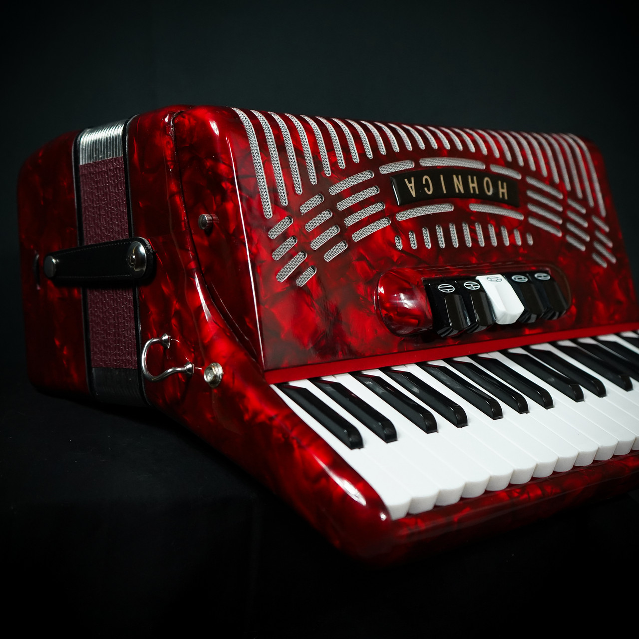 The Hohner Hohnica 1305 72-Bass Pearl Red Accordion offers rich tone, smooth playability, and Hohner qualityâ€”perfect for students and hobbyists. Shop now!